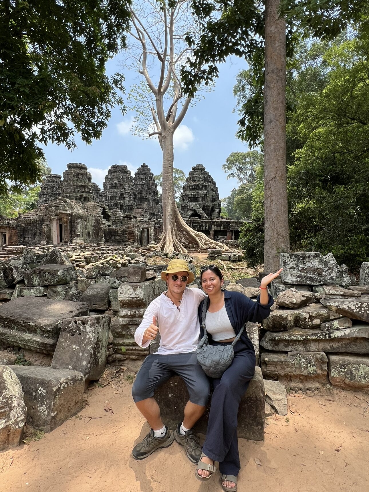 Ollie with a fellow traveller among temple ruins in Cambodia
